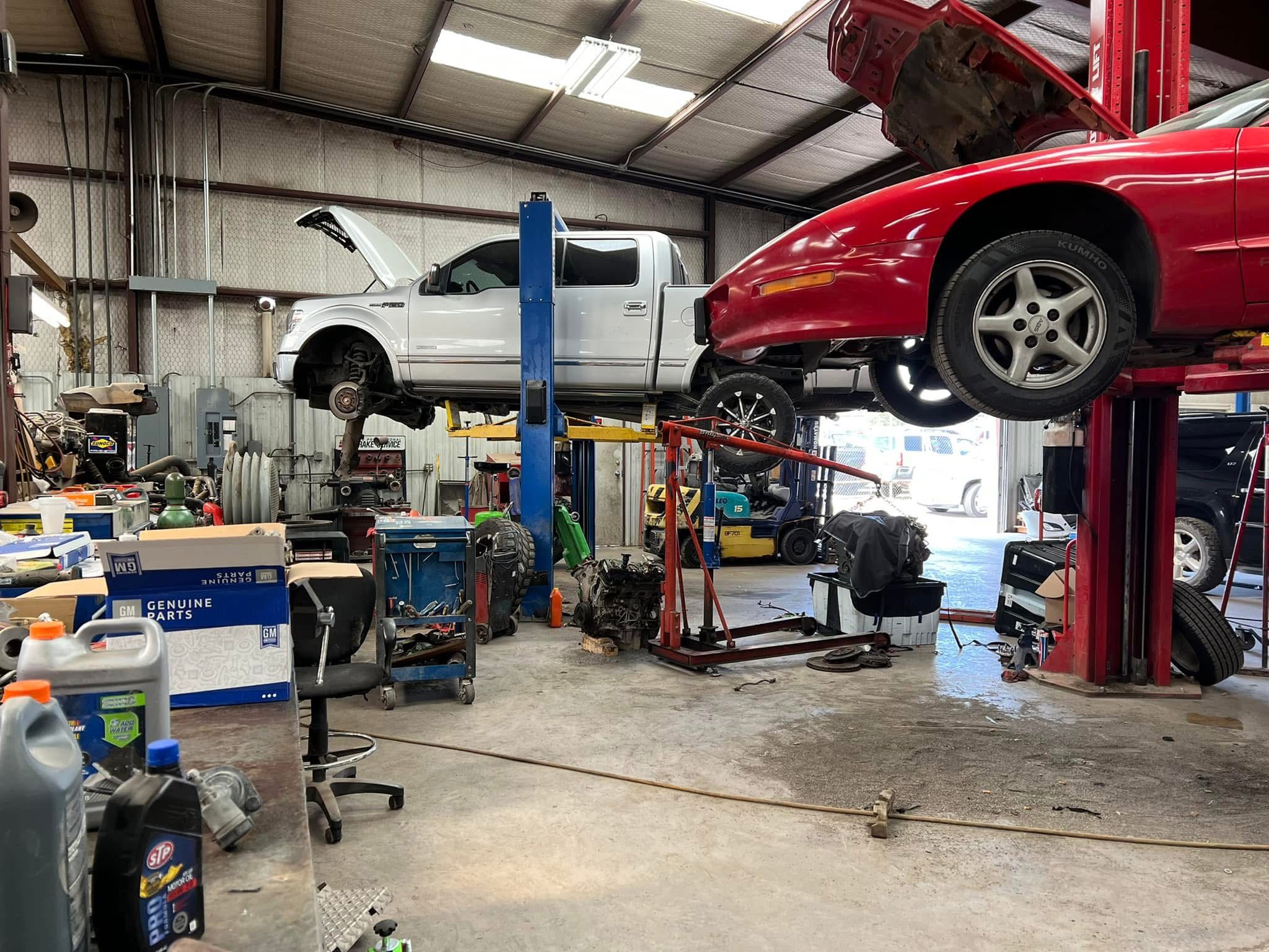shop-car-and-truck-on-lift